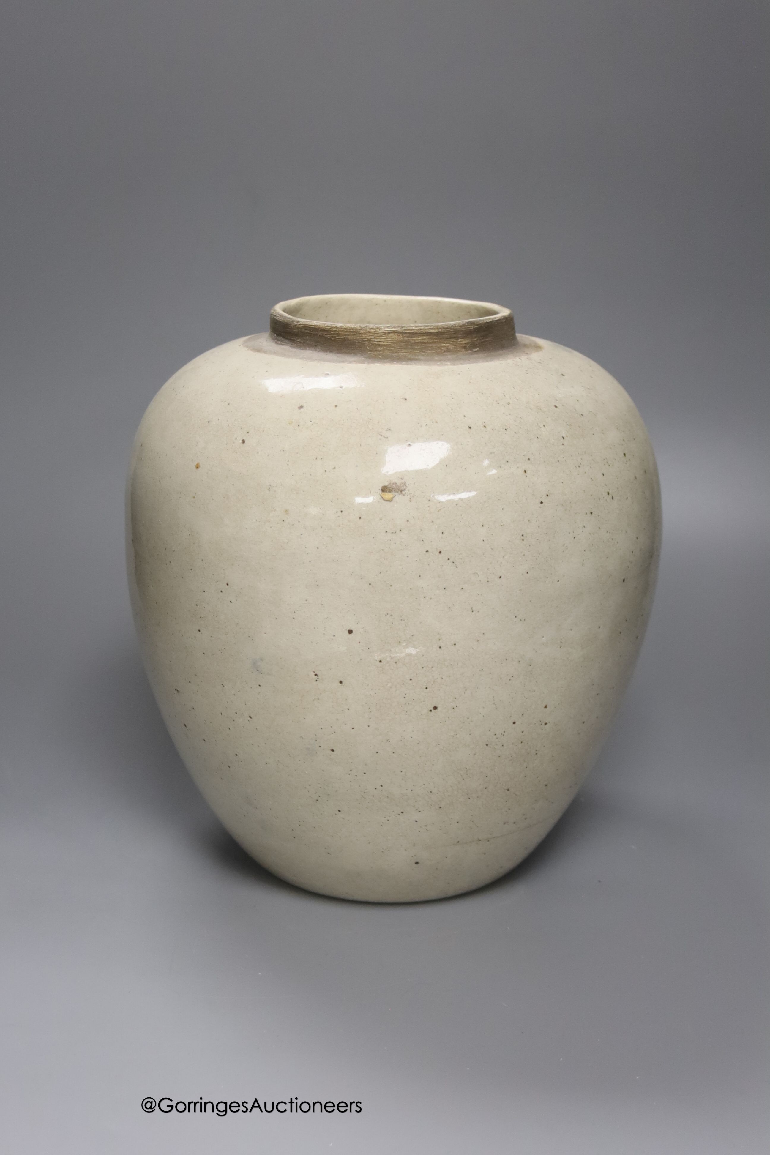 A tin-glazed terracotta barber's bowl dated 1819, a large ovoid eathenware ‘Taback’ jar and three earthenware jugs